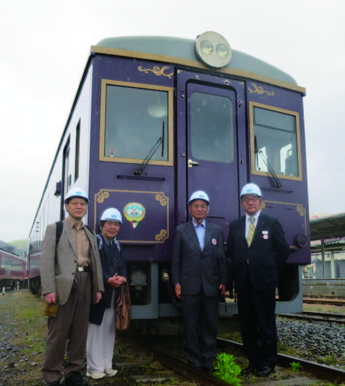 Commemorative photo with the Kuwait Commemorative Vehicle at the train yard.  From left to right: The author, Mrs. Kobayashi, Mr. Yutaka Takahashi, President Yoshiaki Ishikawa